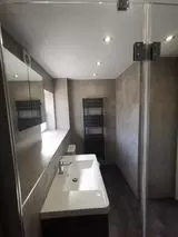 Walk-in shower enclosure fitted by APG Plumbing & Heating Services Ltd in Cannock
