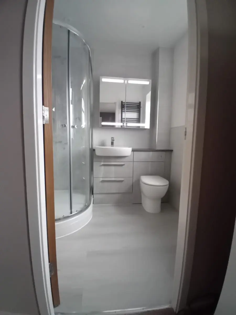 Walk-in shower enclosure fitted by APG Plumbing & Heating Services Ltd in Cannock